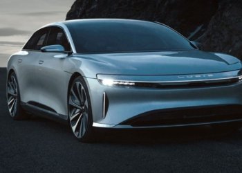 Lucid Air sedan parked near a modern building