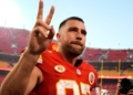 Travis Kelce football helmet slap